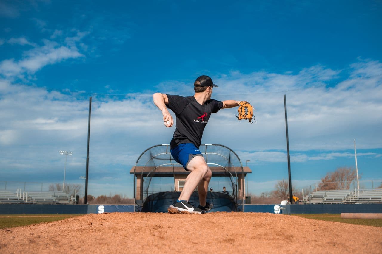 Pitcher delivering from the mound